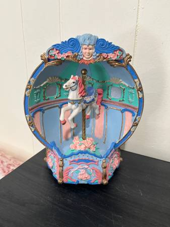 A decorative musical carousel music box with a horse 1