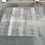 Area Rug -( regtangular size: 7'10" x 10' - gold/beige colored )- Used 1 thumbnail