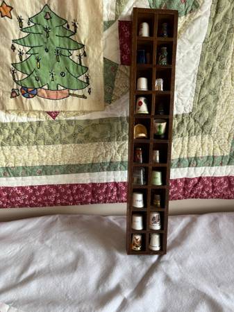 Thimble holder with mounting hardware on back, included are 20 thimbles, firm on 1