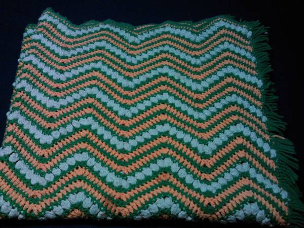 Used knit green/tan blanket 1