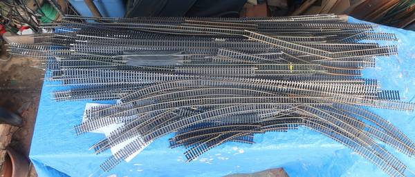 Several HO Train tracks , train cars, bridges , tressels, ETC. 1