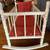 DOLL CRADLE, WHITE PAINTED WOOD, RED FLORAL BEDDING,25.5L x18.5Wx18.5H 4 thumbnail