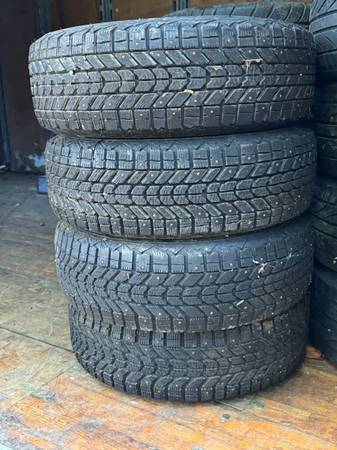 4 Uniroyal winter tires mounted on rims and studded 1