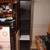 6 ft tall black lovely cabinet with glass shelves and light 2 thumbnail