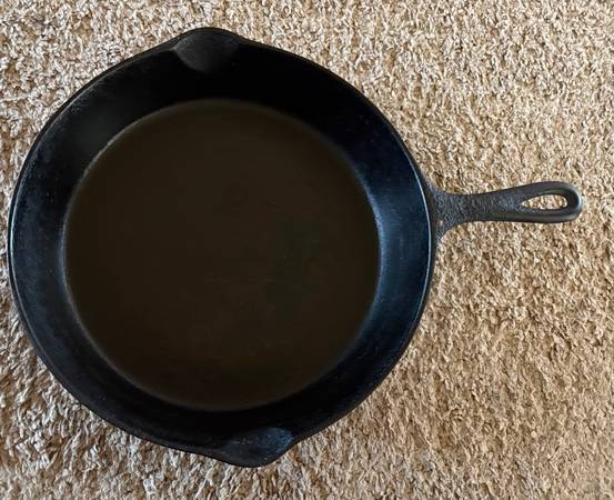 GOOD USED CONDITION VINTAGE BLACK CAST IRON DOUBLE SPOUT SKILLET ..... 1