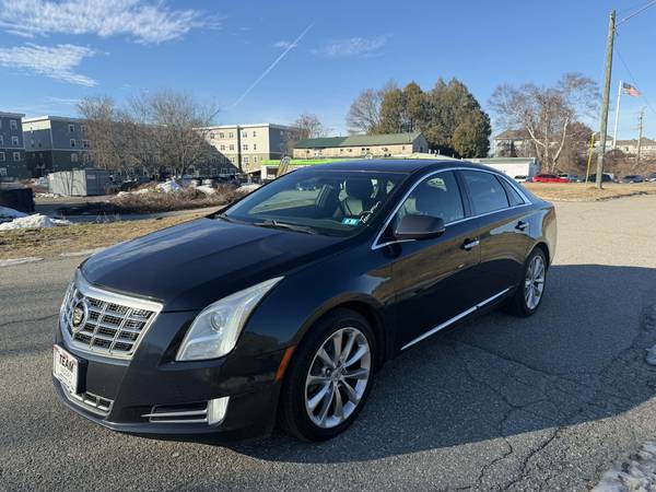 2015 cadillac xts 20-day plate 1