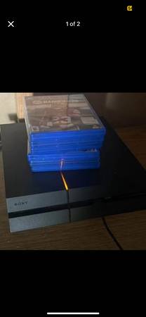 PlayStation 4 with controllers and games 1