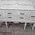 Striking vintage white buffet/sideboard with black hardware. 1 thumbnail