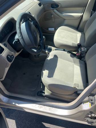 2007 Gold Ford Focus - $3,000 (Cheyenne)63442965565443123