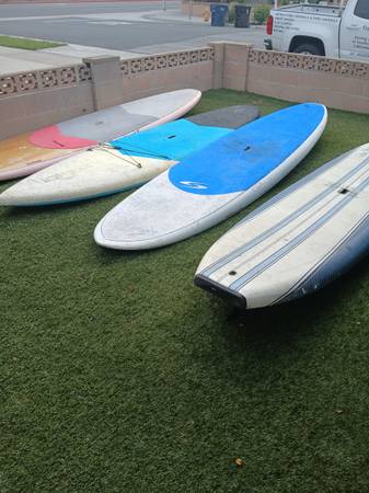 8 USED PADDLE BOARDS 1