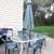 WHITE OUTDOOR GLASS TABLE WITH UMBRELLA 4 thumbnail