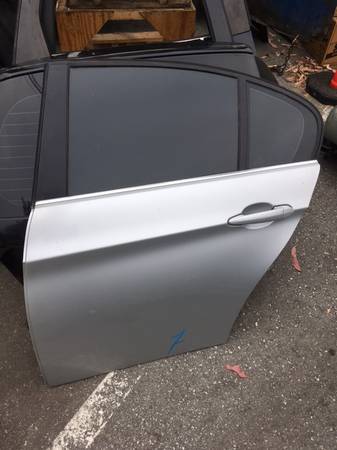 BMW E90 driver rear door; Silver w/ dark 3.0 tint, very good condition 1