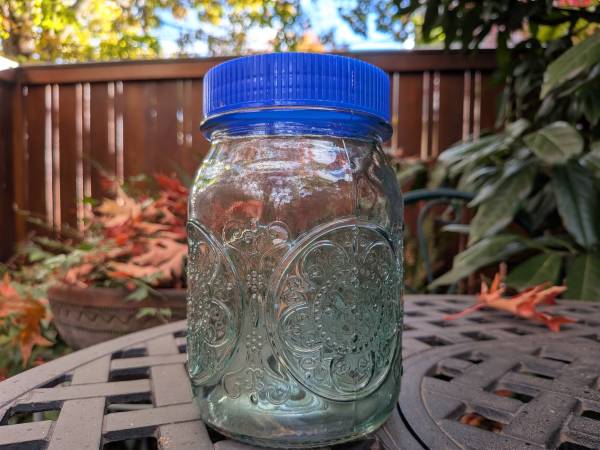 Embossed Medallion Glass Jar 28oz with Blue Lid, Half Green 1