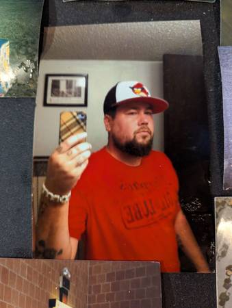 FOUND: 40-50 photos found at southeast corner of Elm Lake Preserve 1