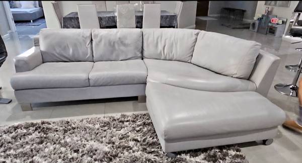 Light Grey Leather Sectional Sofa with rotating chaise/ottoman 1