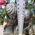An enchanting siblings reading on bench garden statue 8 thumbnail