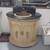 small brass sink mounted in a half moon vanity with black stone top 18 thumbnail