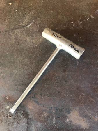 Chainsaw wrench + screwdriver = scrench 1