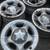 2004 FORD STEEL RIMS -17-“ all-4- have 3- caps and all lugs 1 thumbnail