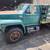1987 FORD F700 STAKE BED WITH LIFT GATE LOW MILES 5 thumbnail