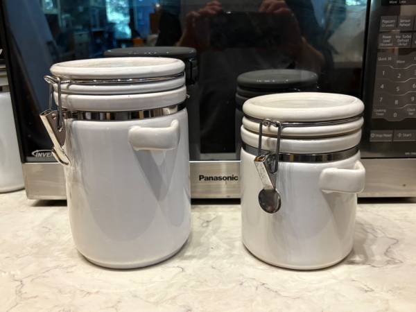 2 white kitchen canisters 1