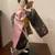 Japanese Geisha doll  wearing a pink  floral kimono with a golden fan 1 thumbnail