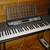 Yamaha EZ-200 61-Key Full-Size Touch Sensitive Lighted Keyboard &Stand 2 thumbnail
