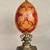 Hand-painted porcelain egg sculpture centerpiece on brass/marble stand 1 thumbnail