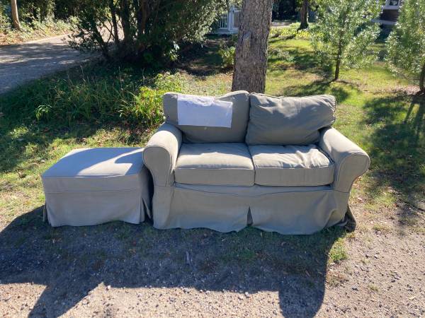 Well loved Pottery Barn loveseat and ottoman 1