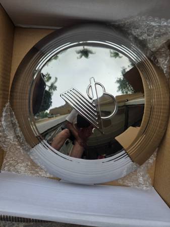 2 new V8 hubcaps, 1