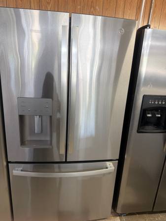 GE front door stainless refrigerator less than a year old 1