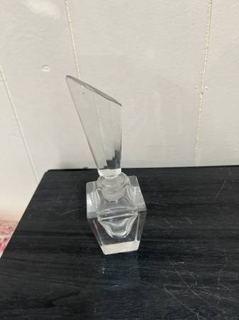 A crystal perfume bottle with a stopper 1