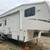 Toy hauler raptor by Keystone Onan generator AC awning 1 thumbnail