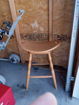 For sale 30"oak swiveling (saddle) bar stool 1