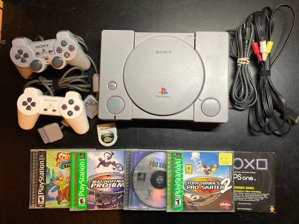 PS1 console with controllers, games and steering wheel 1