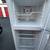 Clean GE top-freezer refrigerator in white. This unit has a top freezer compartm 5 thumbnail