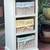 White Wood Shelving storage unit with 3 pull out wicker basket/drawers 1 thumbnail