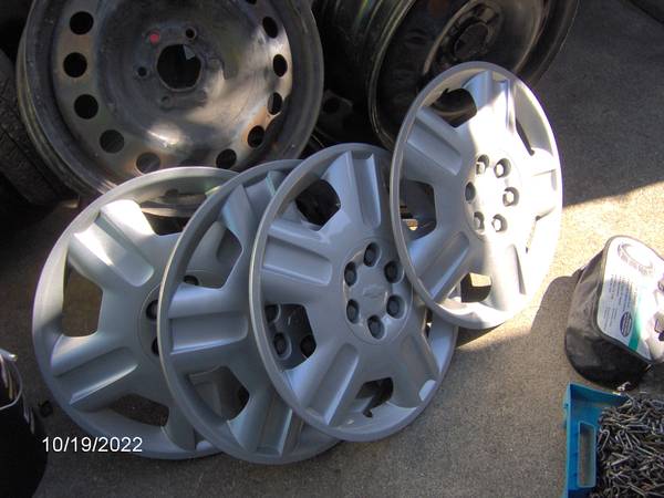 4 chevy 17 inch hubcaps 1