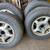 SET OF (4) 15”x6” 5 SPOKE ALUMINUM RIMS AND TIRES FOR A 2001 LESABRE 1 thumbnail
