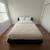 Mario Bellini Couch, CB2 Leather Daybed, TV/Stand, Green Checkered Rug 4 thumbnail
