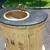 small brass sink mounted in a half moon vanity with black stone top 5 thumbnail