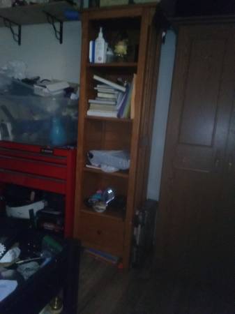 Wooden bookshelf w/ 4 shelves & 1 drawer at the bottom with a coat ord 1
