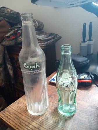 One Vintage Coca Cola and One Vintage Crush Soda Bottle. In great shap 1