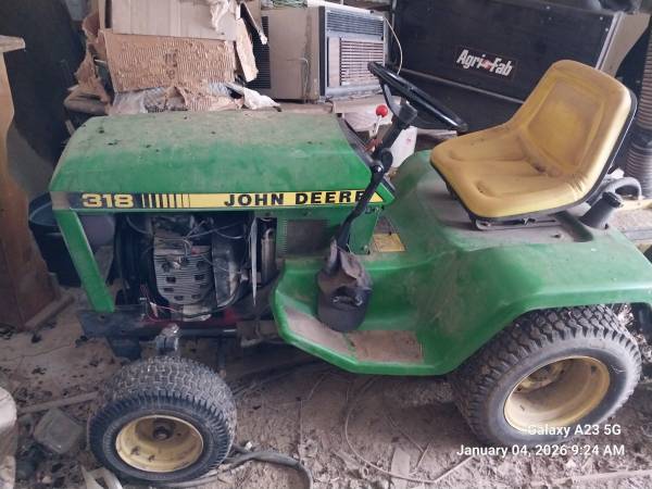 John Deere 318 with attachments 1