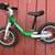 Lightly used Woom 1 balance bike (green) 2 thumbnail
