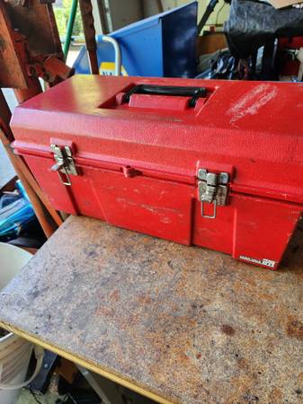 Red plastic with load of tools 1