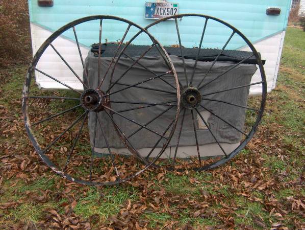 IRON WHEELS "ANTIQUE" IMPLEMENT. WHEELS. 48 INCHES TALL. 1
