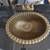 small brass sink mounted in a half moon vanity with black stone top 13 thumbnail