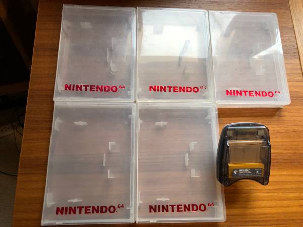 Five Nintendo 64 Game Cases and Transfer Pak 1