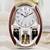KELAOT Musical Motion Chime Wall Clock with Rotating Pendulum Decorati 1 thumbnail